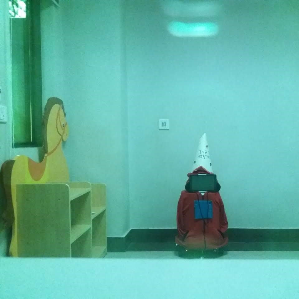 Robo-Chotu wearing birthday hat and turned off