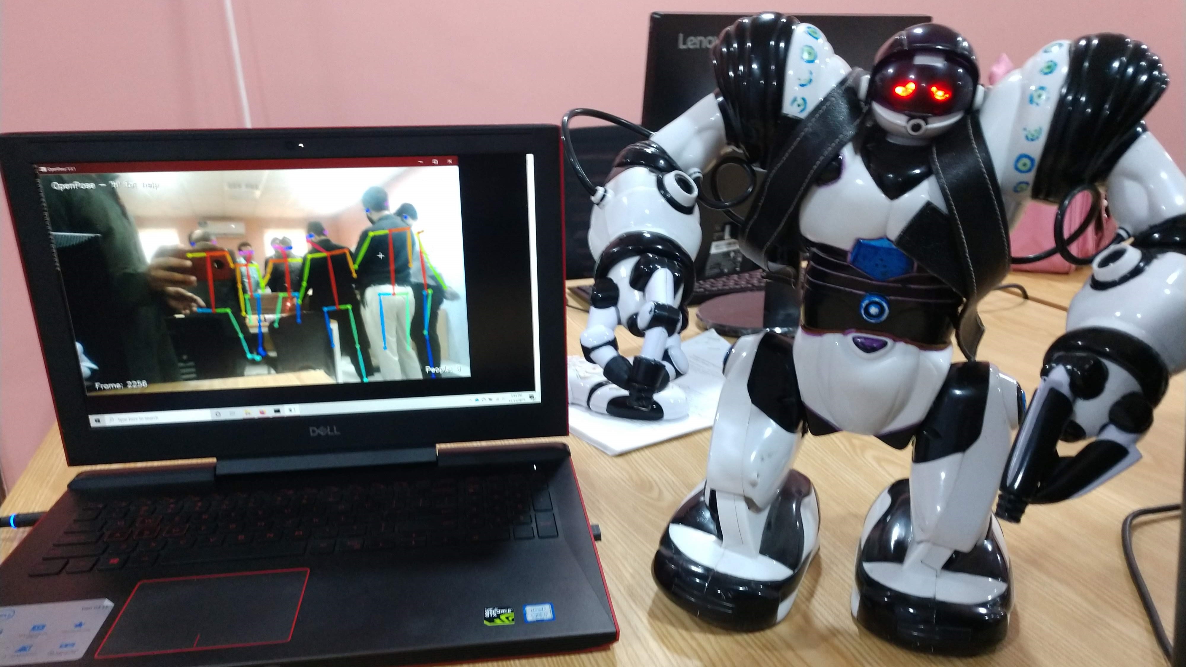 OpenPose detection of human skeleton and augmented Robosapien wearing a bag containing ESP8266