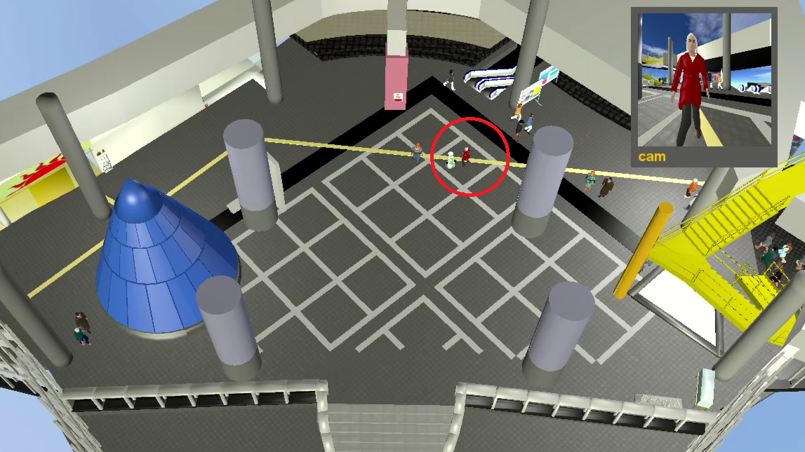 Robot inhibits movement of an individual in a large hall in a mall.